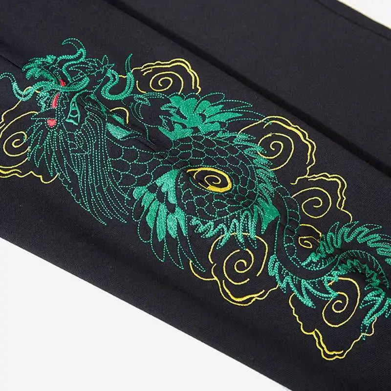 Jogging pants with embroidered dragons 