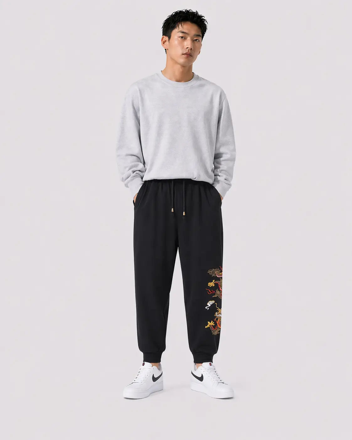 Gold dragon embroidered jogging pants 